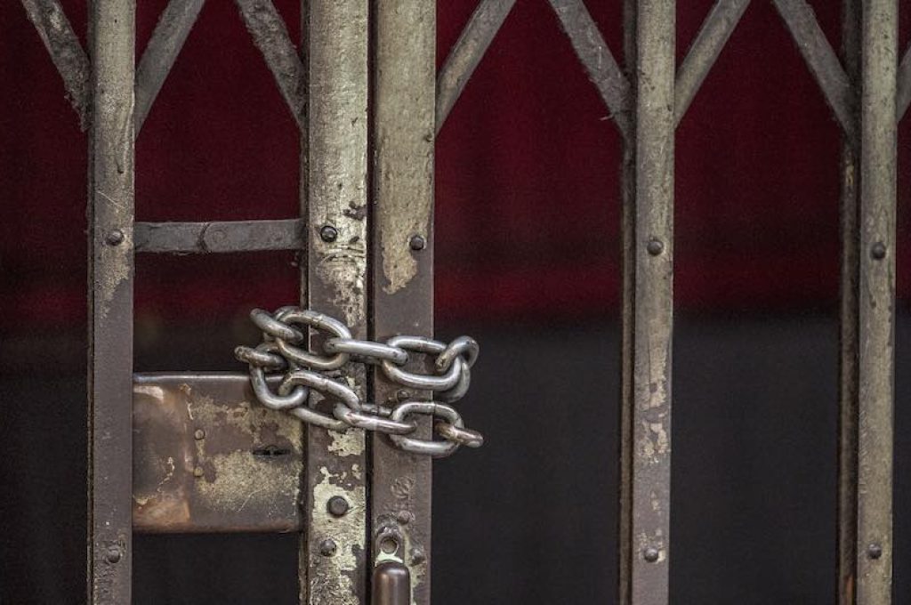 Closeup of chained sliding grille door