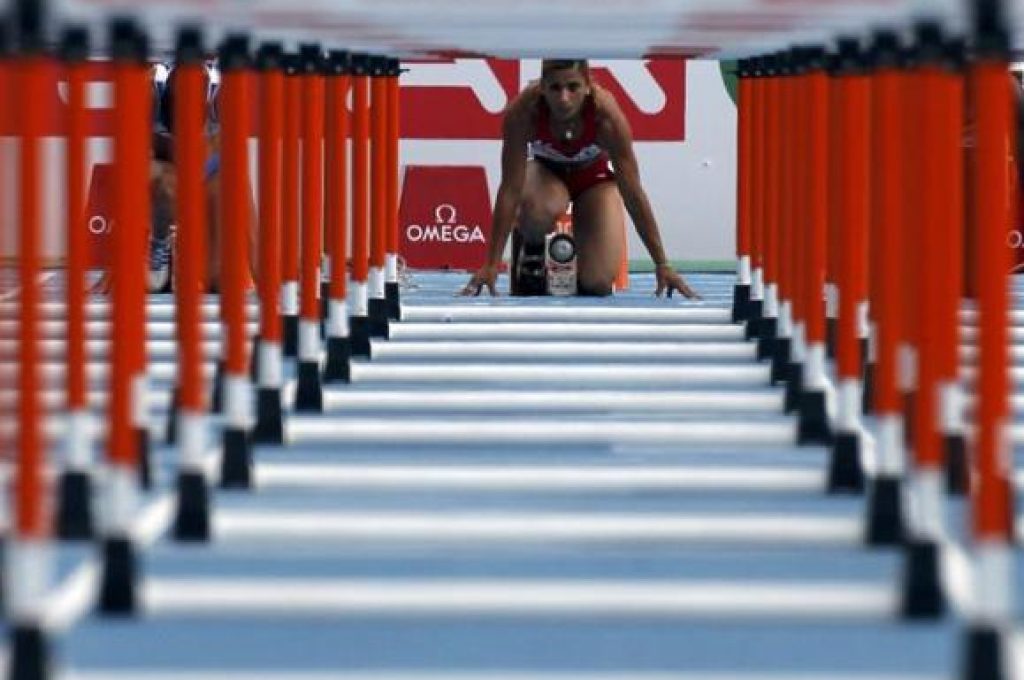 Nevin Yanit from Turkey prepares to start for the women's 100 metres hurdles heats the European Athletics Championships at the Olympic stadium in Barcelona July 30, 2010.   REUTERS/Sergio Perez (SPAIN  - Tags: SPORT ATHLETICS)